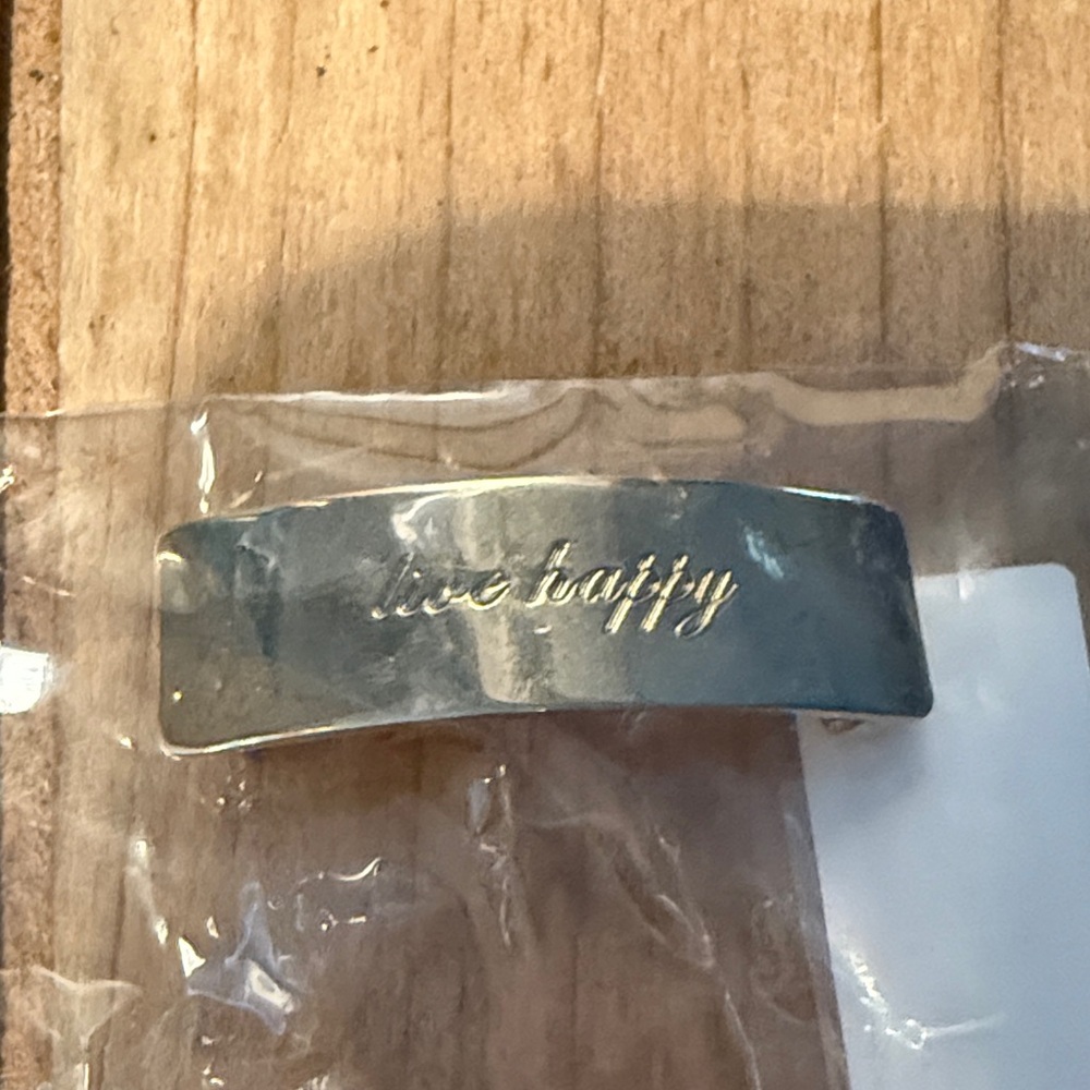 Gold “live happy” long bar for keep collective